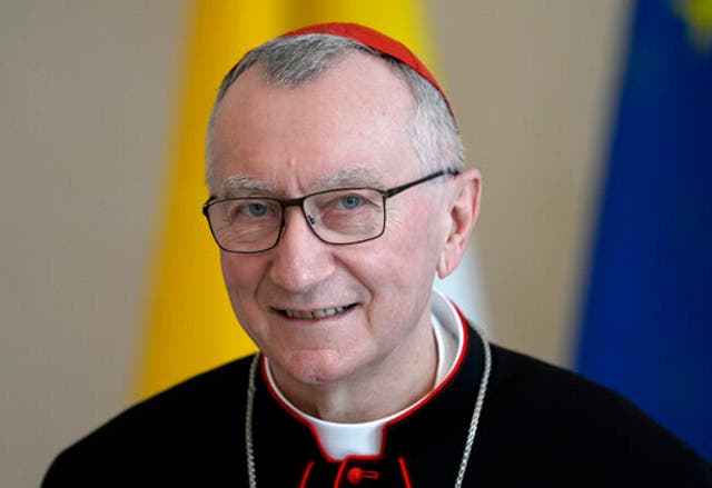 <p>FILE - Vatican Secretary of State Cardinal Pietro Parolin smiles as he is welcomed by German President Frank-Walter Steinmeier for a meeting at the Bellevue palace in Berlin, Germany, Tuesday, June 29, 2021. (AP Photo/Michael Sohn, file)</p>