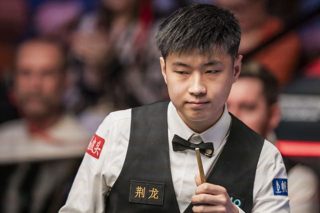 Zhao Xintong cruised into the last 16 of the World Snooker Championship (Danny Lawson/PA)