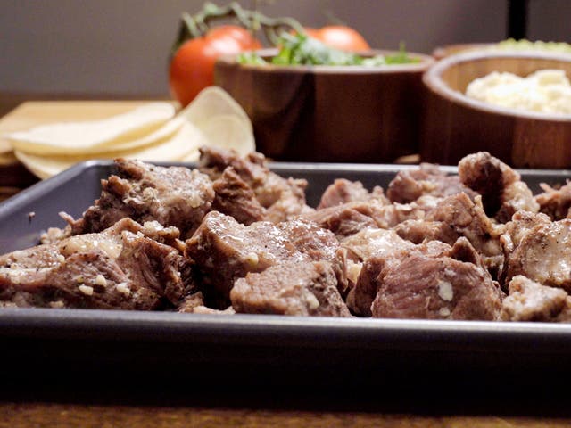 <p>Big pan of shredded pork carnitas </p>