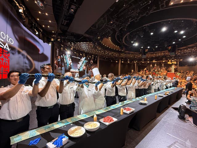 <p>Holland America Line chefs show off the largest sushi roll at sea</p>