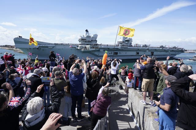 The Royal Navy aircraft carrier, HMS Prince of Wales, sails from Portsmouth Naval Base (Andrew Matthews/PA)
