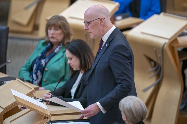 First Minister John Swinney led tributes to Pople Francis during a motion of condolence at Holyrood (Jane Barlow/PA)