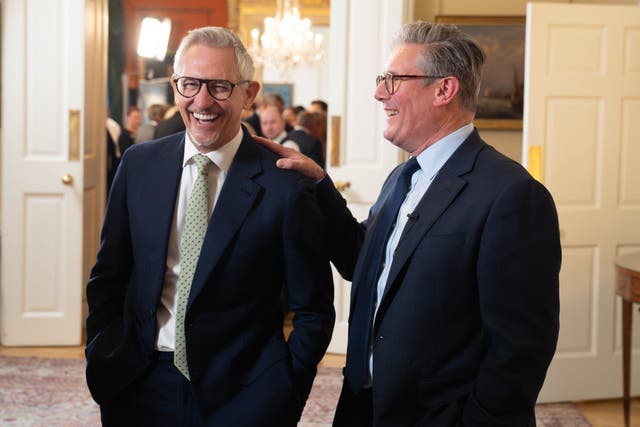 <p>Keir Starmer laughing with Gary Lineker during a reception to celebrate St George’s Day</p>