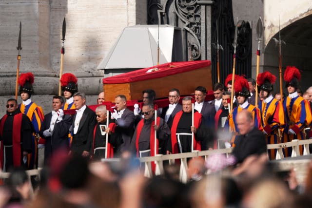 The body of Pope Francis is carried through St Peter’s Square to St Peter’s Basilica at the Vatican (Stefano Costantino/AP)