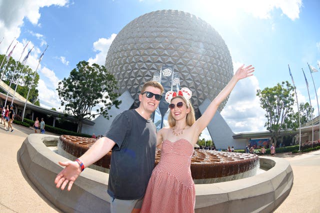<p>Mollie Davies and her partner, James, at Walt Disney World in Florida</p>