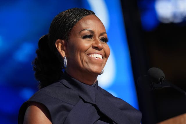 <p>Michelle Obama speaks on stage during the second day of the Democratic National Convention at the United Center on August 20, 2024</p>