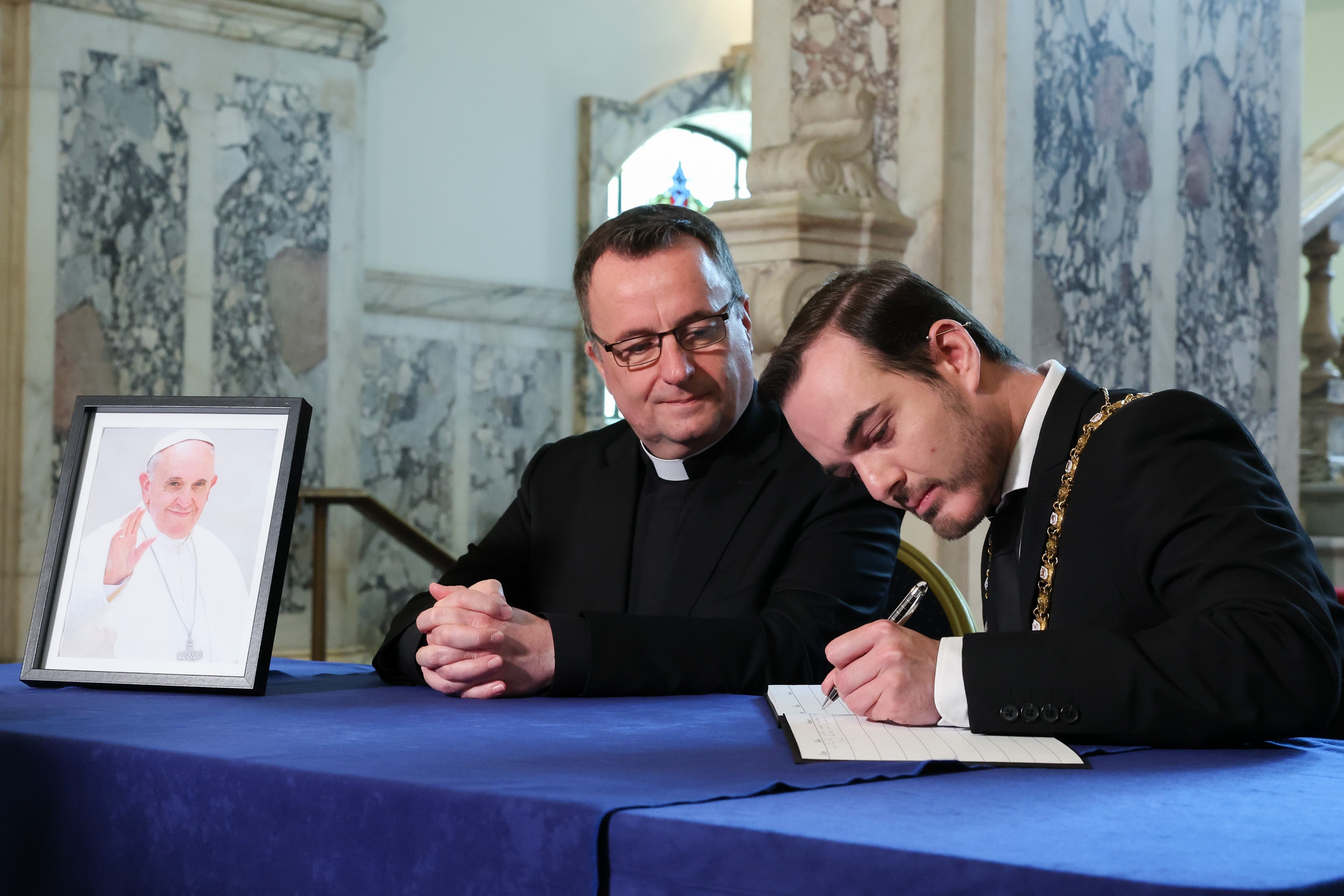 Belfast Lord Mayor Micky Murray (right) was joined at Belfast City Hall by Father Tim Bartlett, who helped to organise Francisās visit to Ireland in 2018 (Belfast City Council/PA)