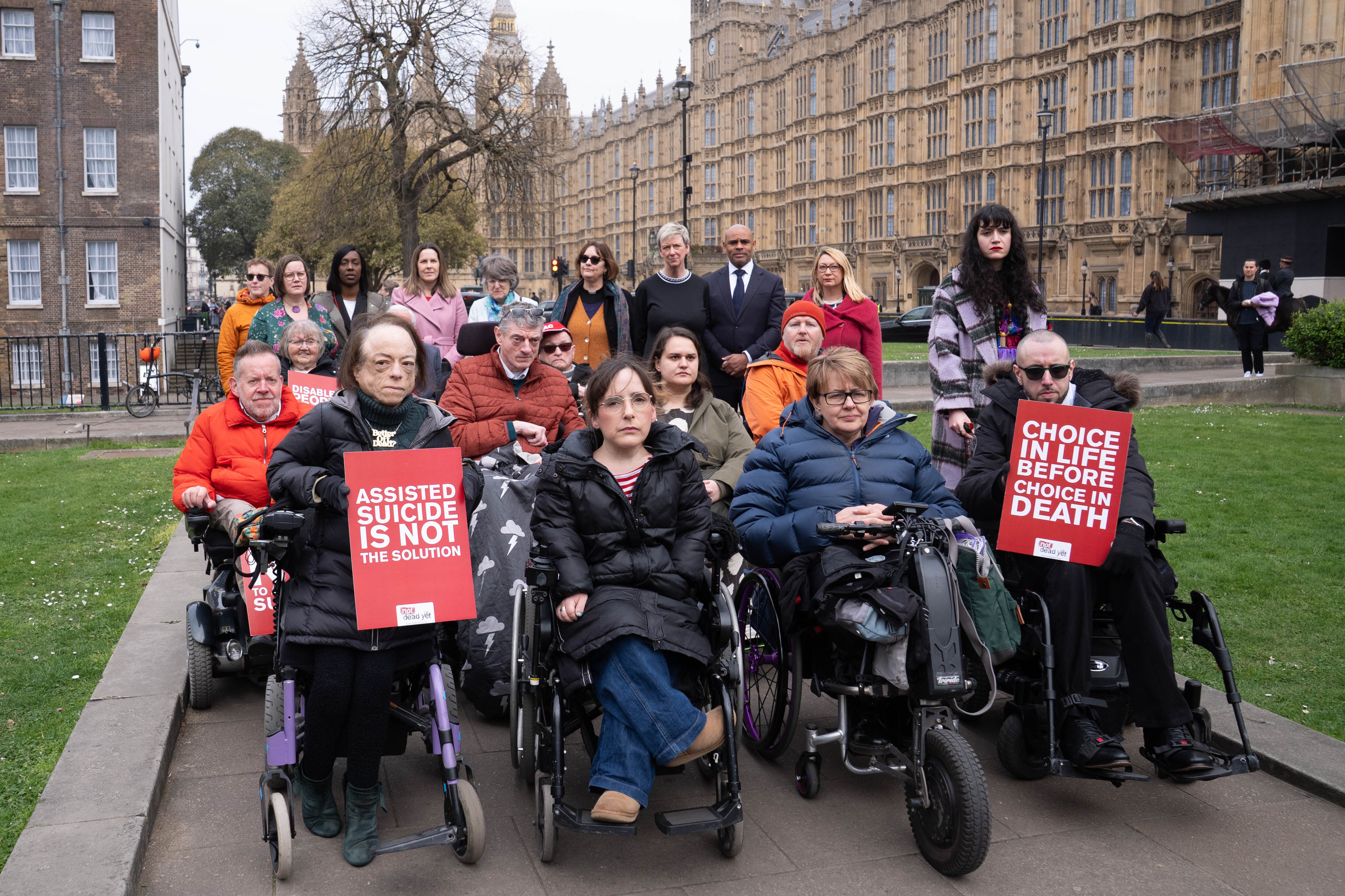 Campaigners including actress Liz Carr and Baroness Grey-Thompson outside the Houses of Parliament (Stefan Rousseau/PA)