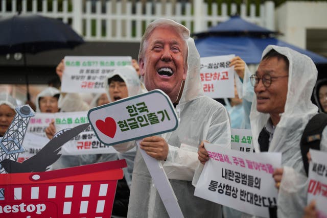 <p>Protester wearing a Donald Trump mask attends a news conference against the US tariffs policy in Seoul on 22 April 2025</p>