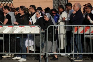 People queue as Pope Francis' coffin moved