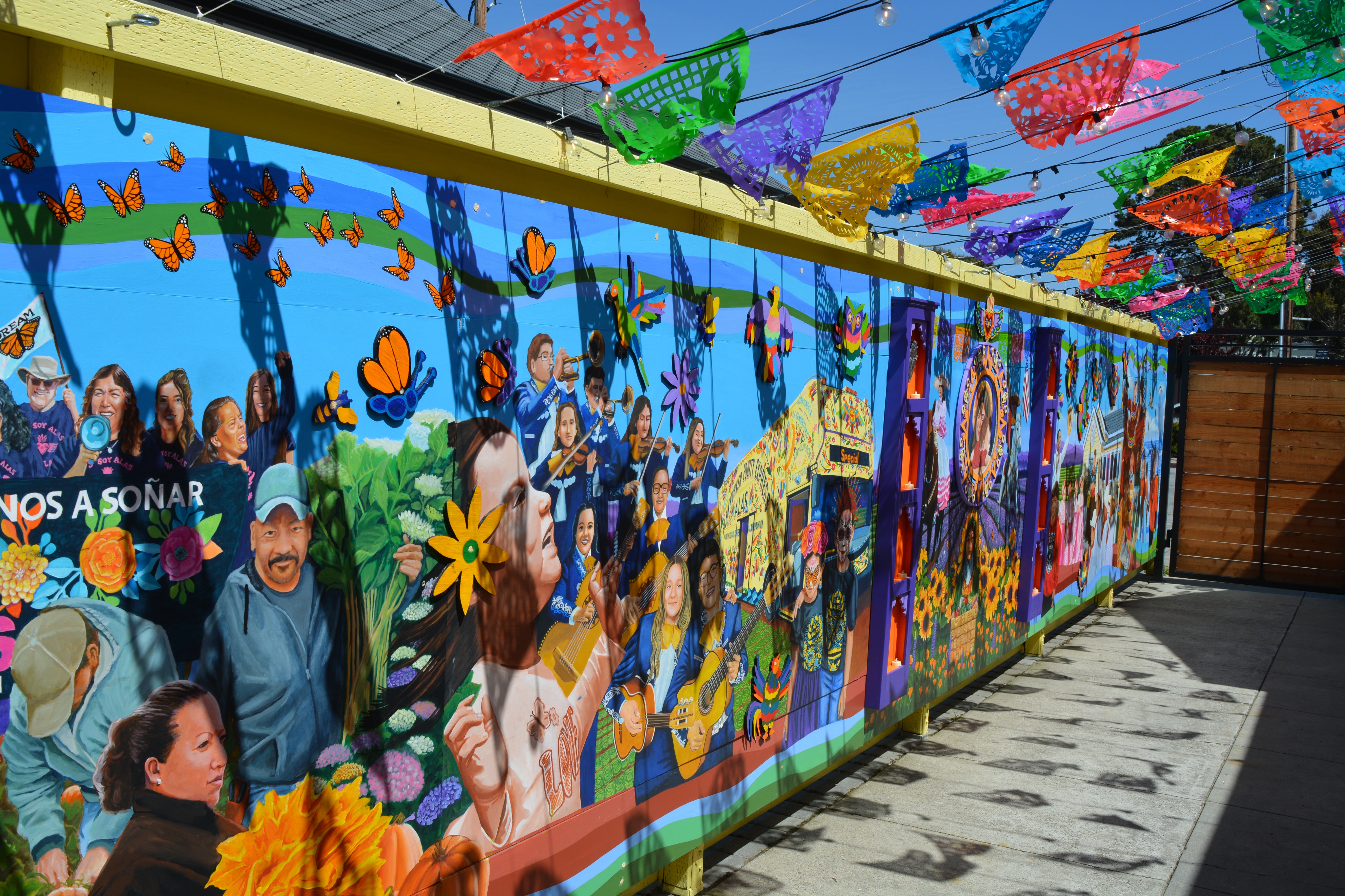 The headquarters of the Ayudando Latinos a Soñar organization in Half Moon Bay that encourages Latino pride and offers a food pantry and other services has had to hire security after an increase in anti-immigrant sentiment