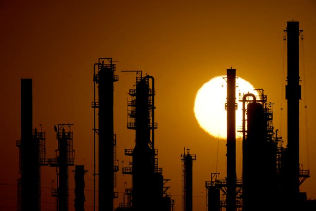 <p>File. CHS oil refinery is silhouetted against the setting sun in Kansas</p>