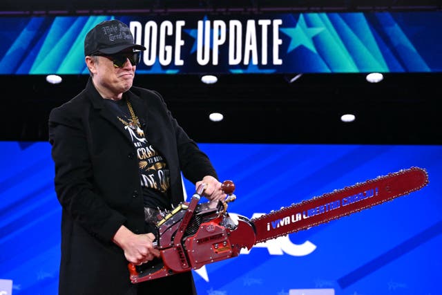 <p>Elon Musk holds a chainsaw reading "Long live freedom, damn it" during the annual Conservative Political Action Conference (CPAC) in Maryland on February 20, 2025</p>