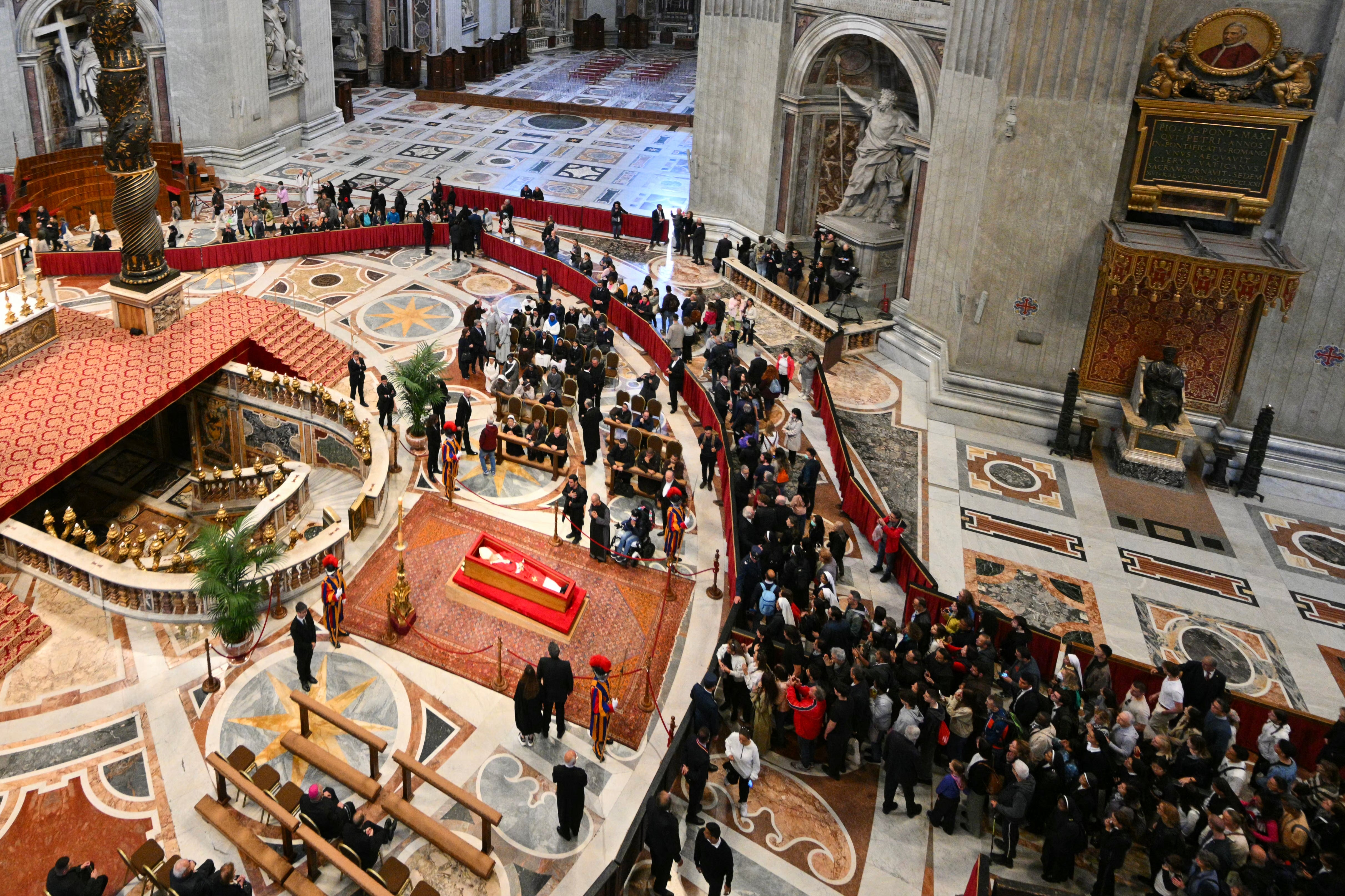 <p>Visitors queue to pay their respects to the late Pope Francis as he lies in state inside St Peter's Basilica in the Vatican</p>