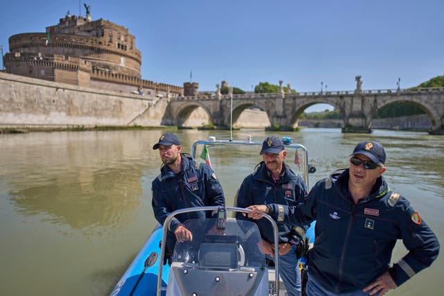 <p>Italian police officers patrol on the Tiber river near the Vatican in Rome</p>