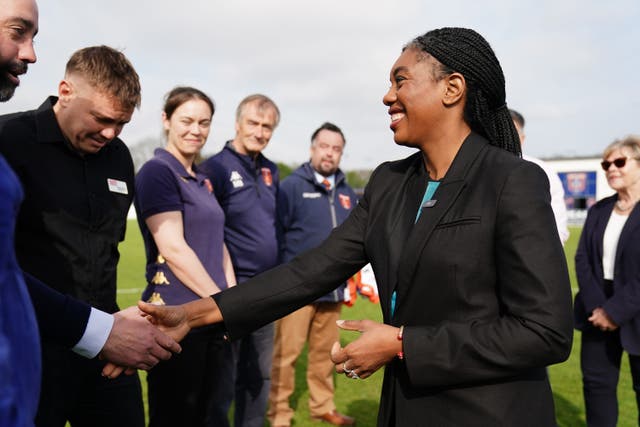 Conservative Party leader Kemi Badenoch meeting staff during a visit to Stratford Town Football Club, in Tiddington, Stratford-upon-Avon, while on the local election campaign trail (Jacob King/PA)