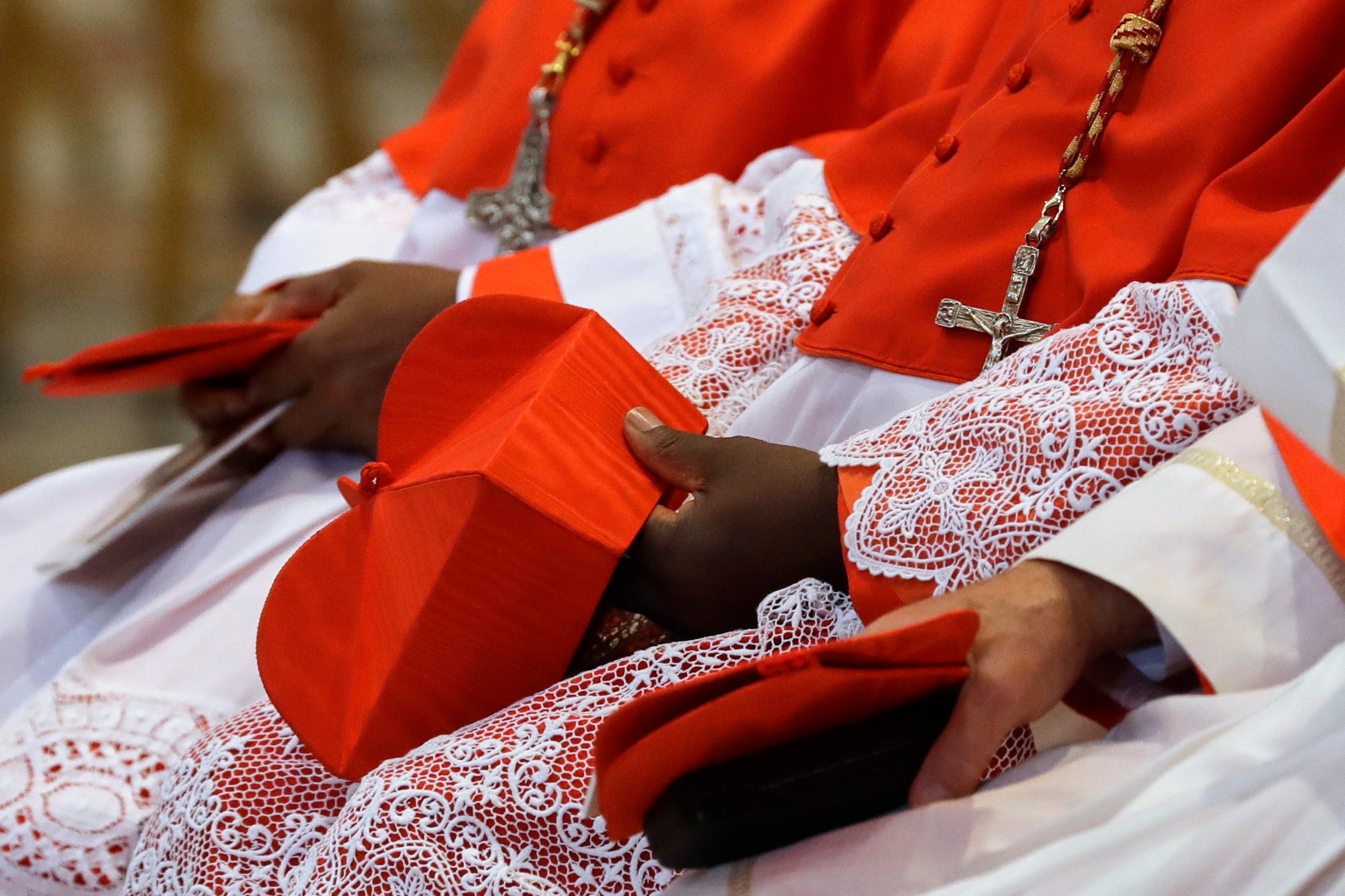 Cardinals inside St Peter’s Basilica at the Vatican (Gregorio Borgia/AP)