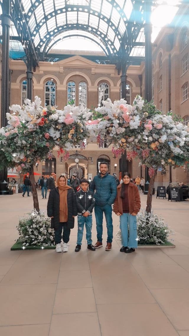 <p>Hamidullah Fahim with his wife Zaghona and their two youngest children in the UK</p>