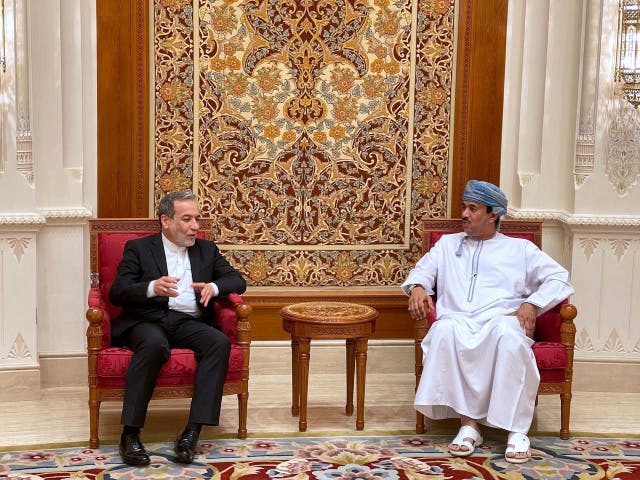 <p>File. Iranian foreign minister Abbas Araghchi, left, speaks with an Omani official ahead of talks with US Mideast envoy Steve Witkoff in Muscat in April 2025</p>