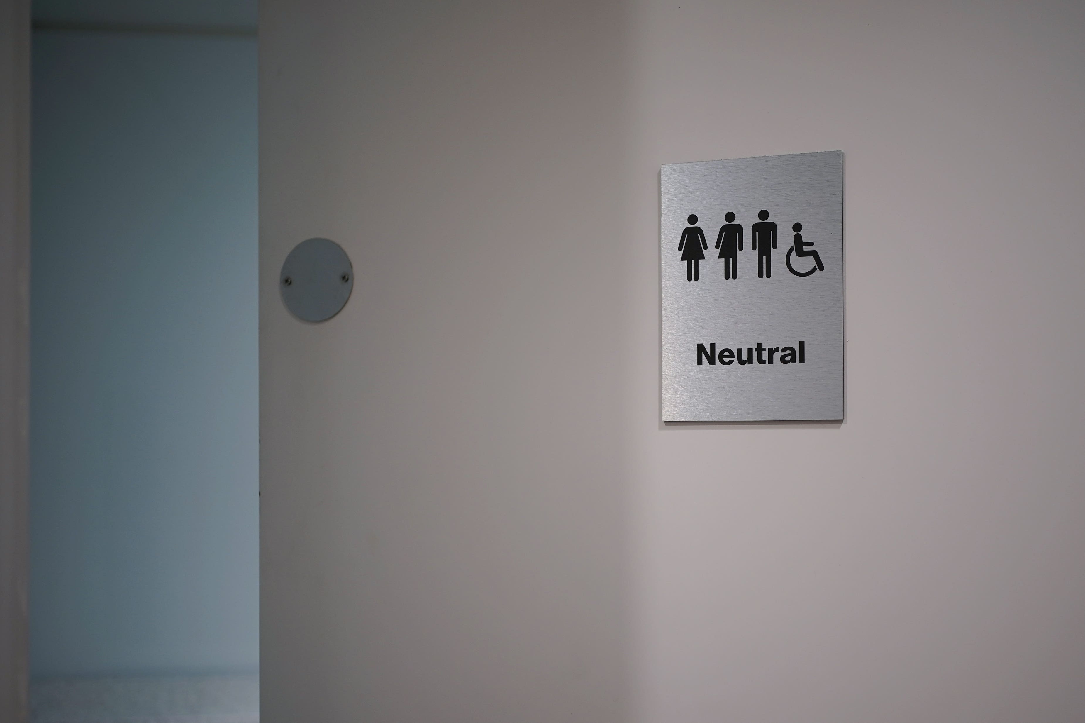The equalities watchdog has issued guidance for workplaces and public-facing services (Yui Mok/PA)