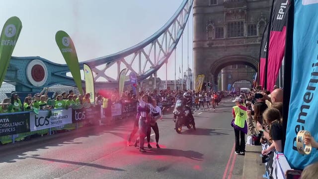 <p>Protesters disrupt London Marathon with powder demonstration on Tower Bridge</p>