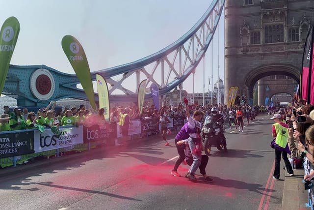 <p>The protest during the TCS London Marathon on Tower Bridge, London </p>