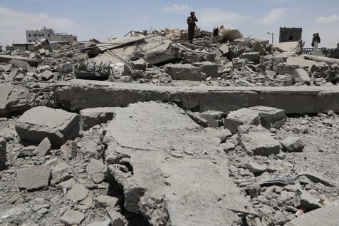 <p>A Yemeni soldier inspects the damage reportedly left by a US air strike</p>