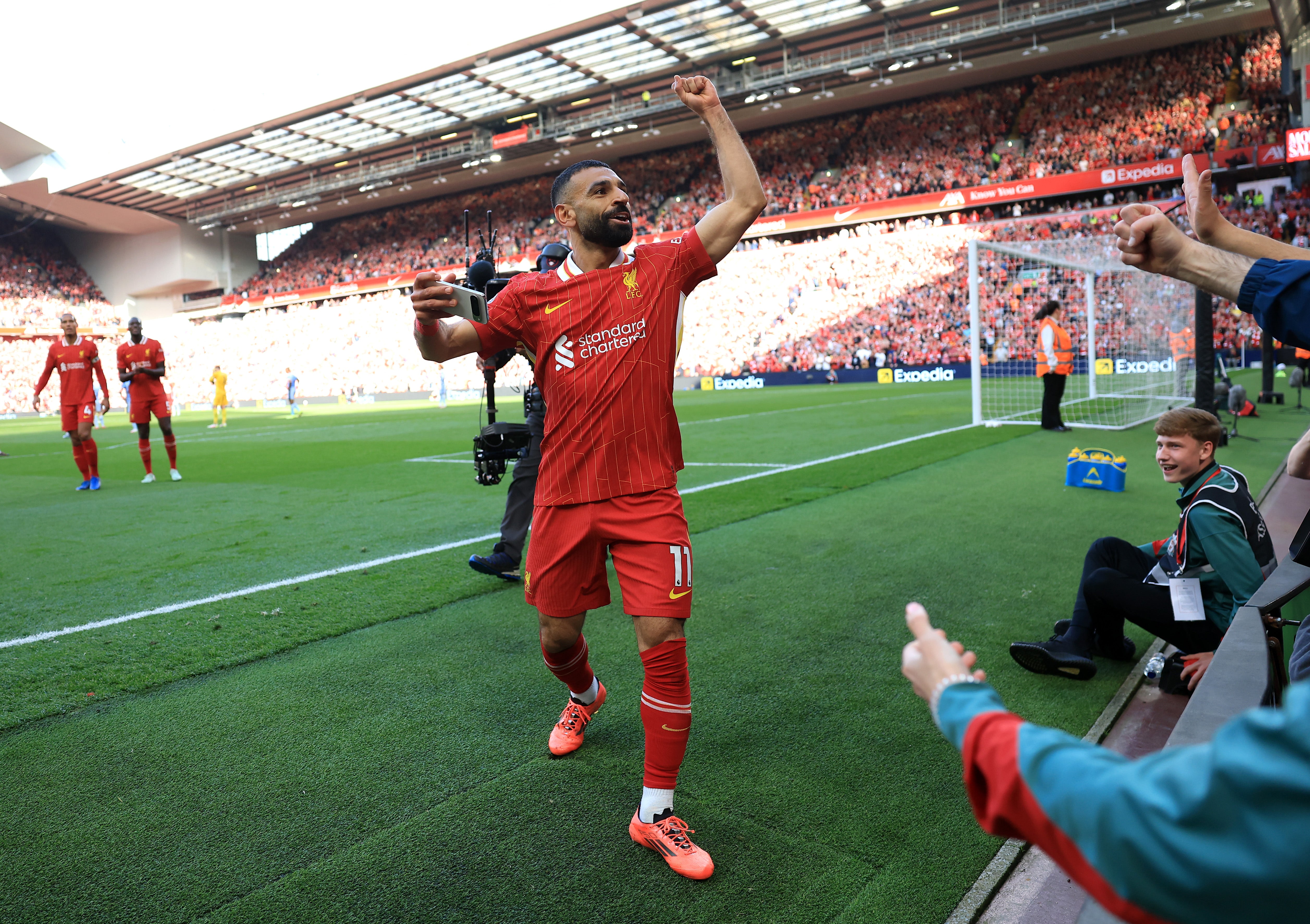 Mohamed Salah attacker deals with a crowd after a match
