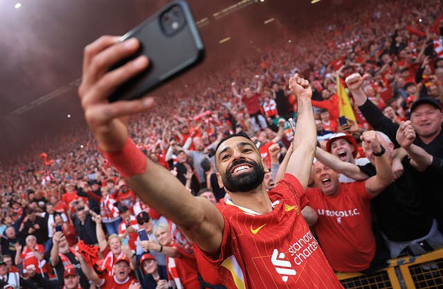 <p>Mohamed Salah celebrated with fans after securing the Premier League title</p>