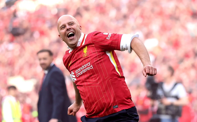 <p>Arne Slot celebrates Liverpool's Premier League title triumph at Anfield</p>
