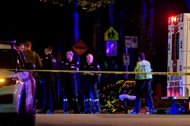 <p>An ambulance is parked at the site of the Lapu Lapu day block party, where a vehicle drove into a crowd killing several people in Vancouver, British Columbia</p>