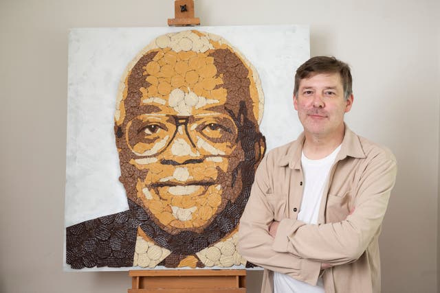 Mosaic artist Ed Chapman has depicted famous British people in biscuit form to mark 100 years of McVitie’s chocolate digestive (PinPep/Will Ireland/PA)