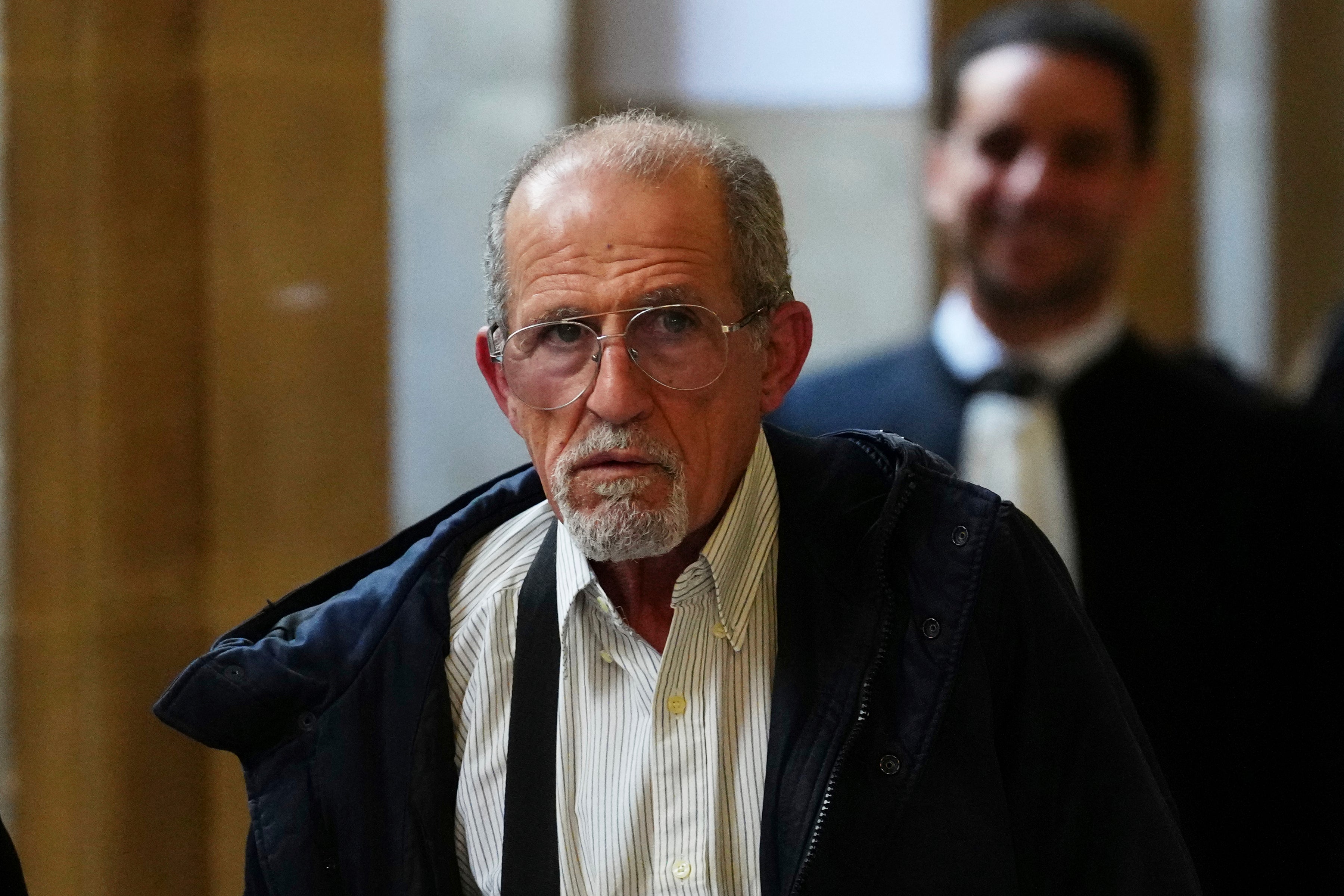 Defendant Aomar Ait Khedache arriving in court in late April