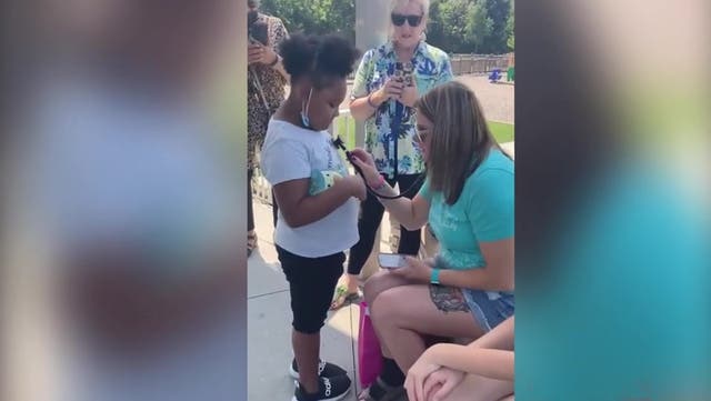 <p>Mother listens to heartbeat of late daughter who donated heart to eight-year-old girl.</p>