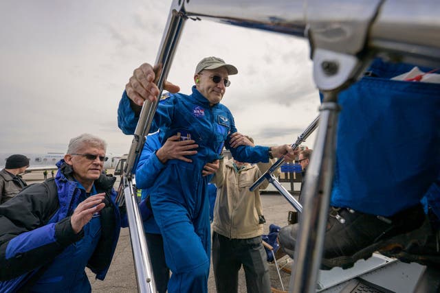 <p>Astronaut Don Pettit boarding a Nasa airplane to take him to Houston</p>