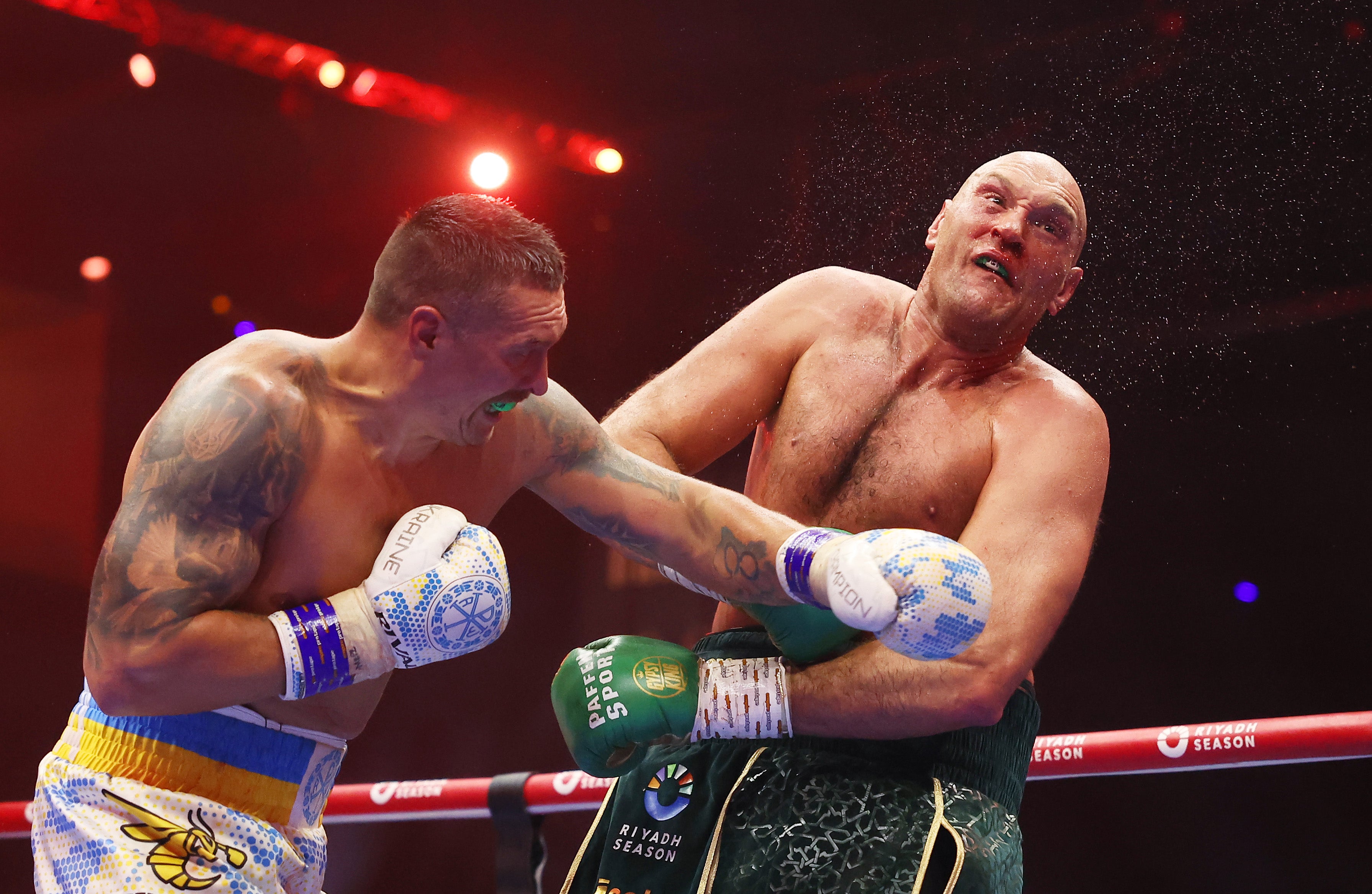 Oleksandr Usyk (left) and Tyson Fury during their first bout in Riyadh