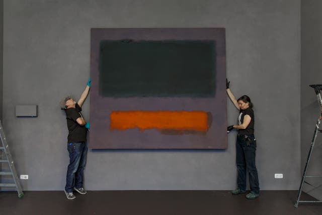 <p>Art handlers from Museum Boijmans Van Beuningen install Rothko's Grey, Orange on Maroon, No.8 </p>