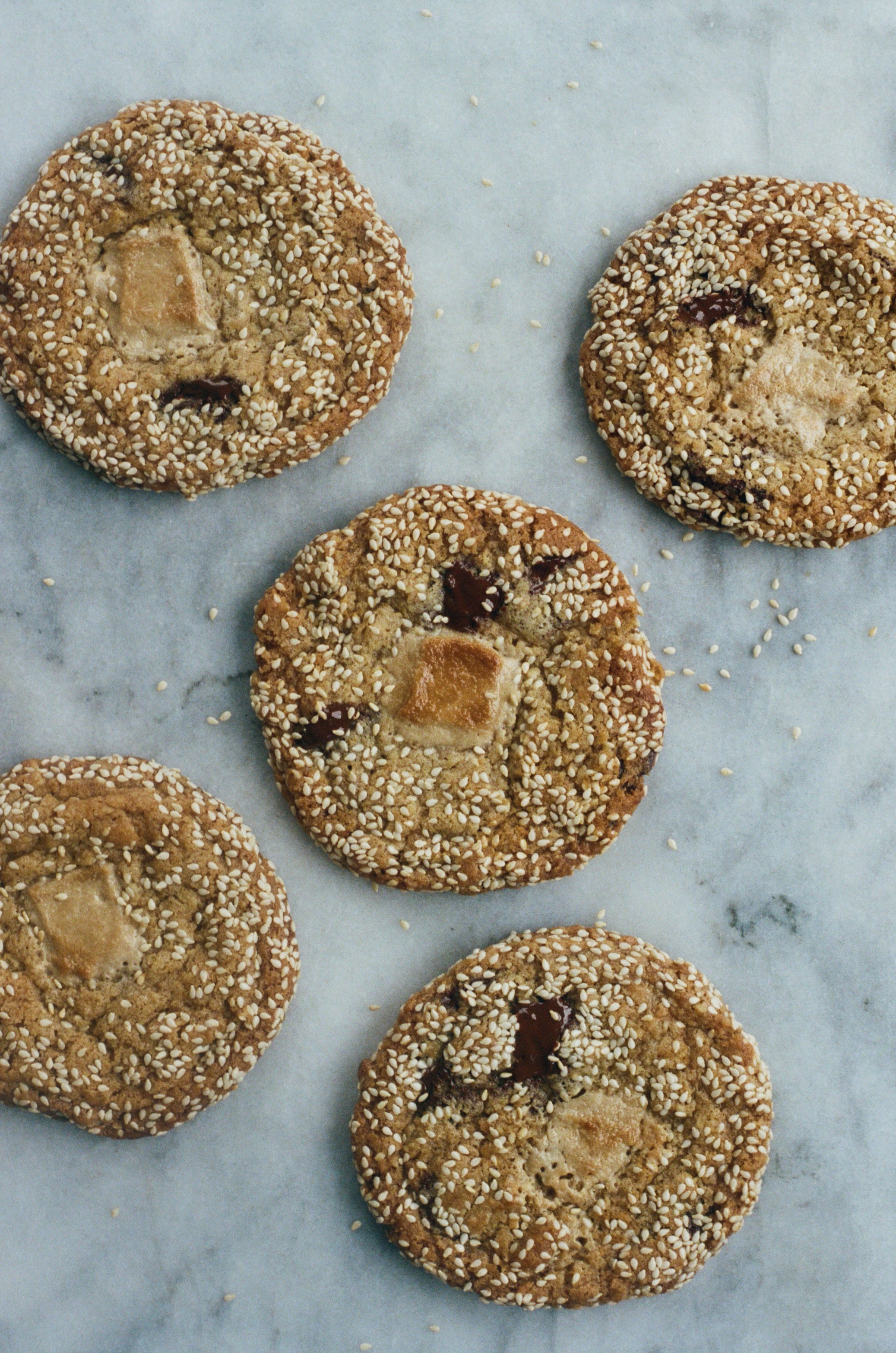 Crisp-edged and chewy-centred, these halva and sesame cookies are as much about generosity as they are about dessert