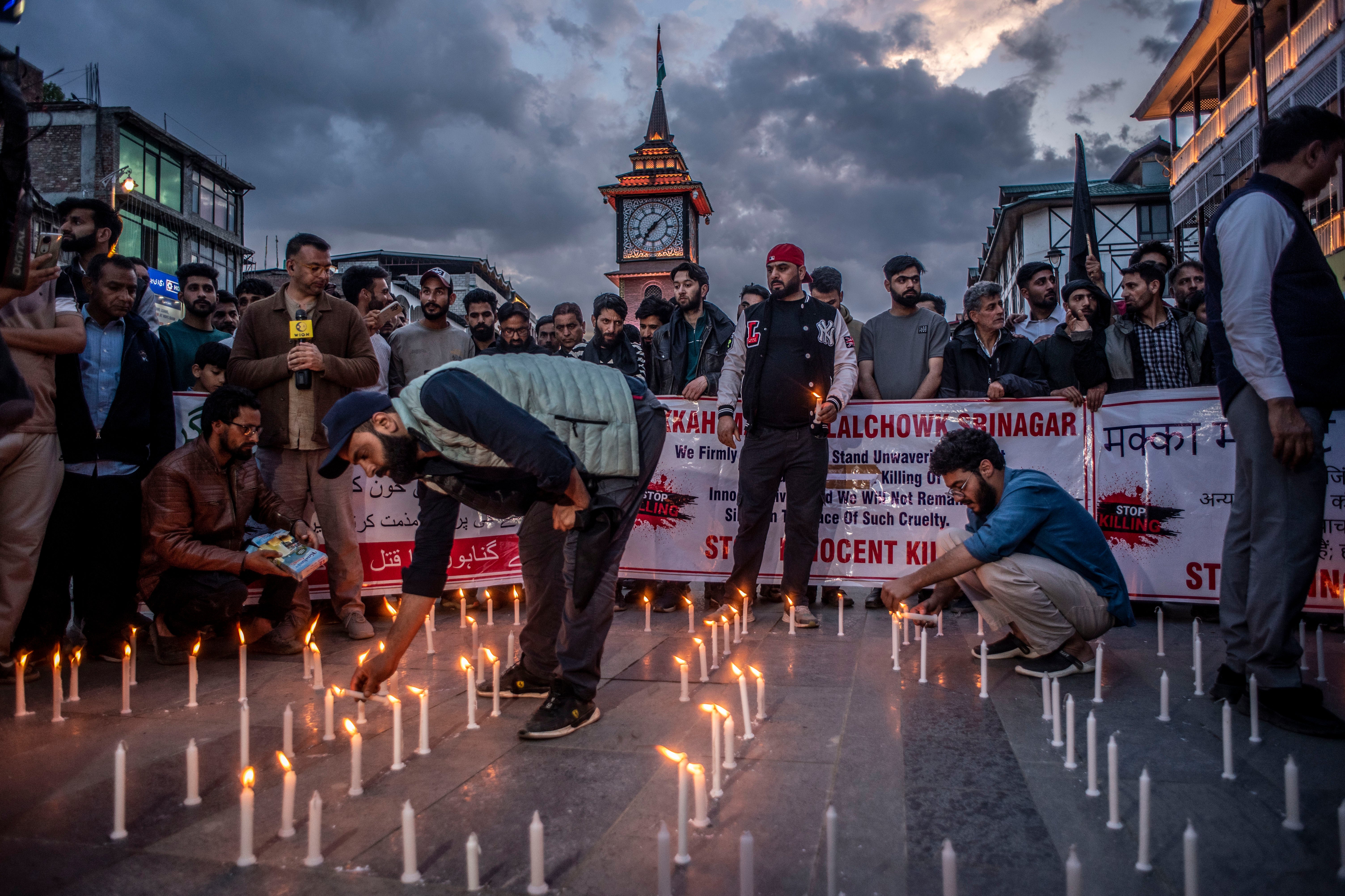 Kashmiri traders hold a candlelight vigil to denounce the Pahalgam attack in Srinagar on 23 April 2025