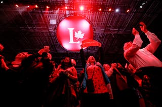Supporters of Canada's prime minister Mark Carney react to polling numbers at the Liberal Party election night headquarters in Ottawa, Ontario, Canada 28 April 2025