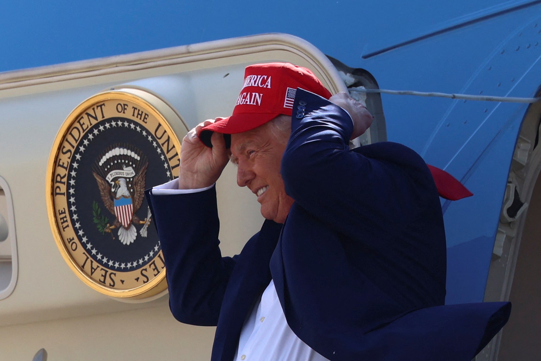 Trump attacks &lsquo;sick political class&rsquo; for &lsquo;bleeding America dry&rsquo; as he marks 100 days in office with Michigan rally: Live