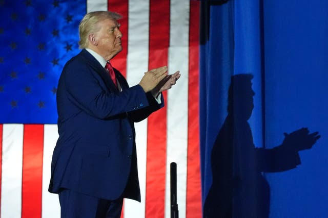 <p>Donald Trump arrives to speak on his first 100 days at Macomb County Community College Sports Expo Center in Warren, Michigan Tuesday (AP Photo/Alex Brandon)</p>
