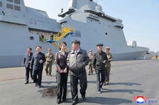 North Korea’s Kim oversees test-firing of missiles from newly launched 5,000-tonne warship