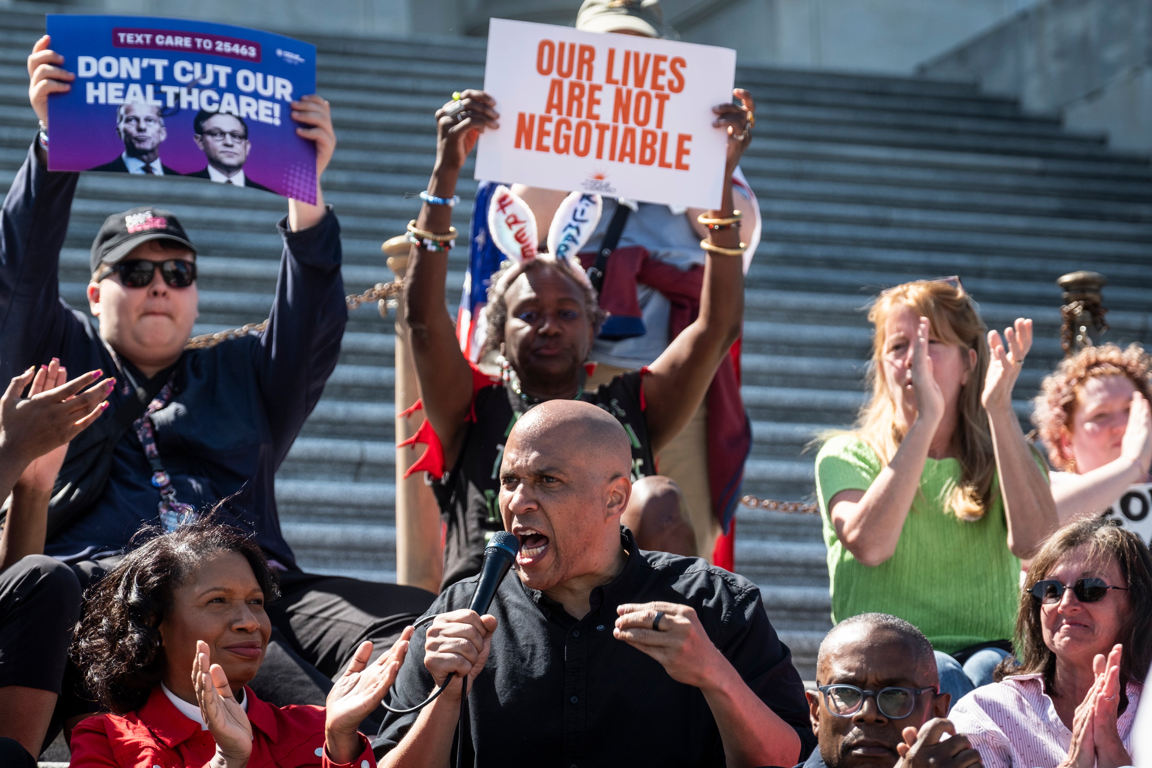 Demonstrators protest against plans to slash Medicaid