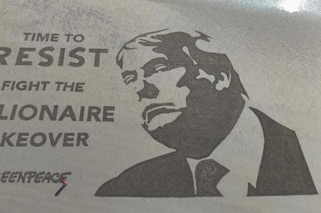 The stunt marks Donald Trump’s first 100 days in office (Greenpeace UK/PA)