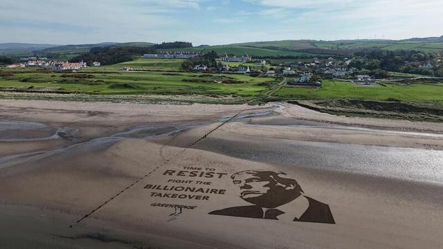 <p>The artwork has been created on sand next to Trump Turnberry (Greenpeace UK/PA)</p>