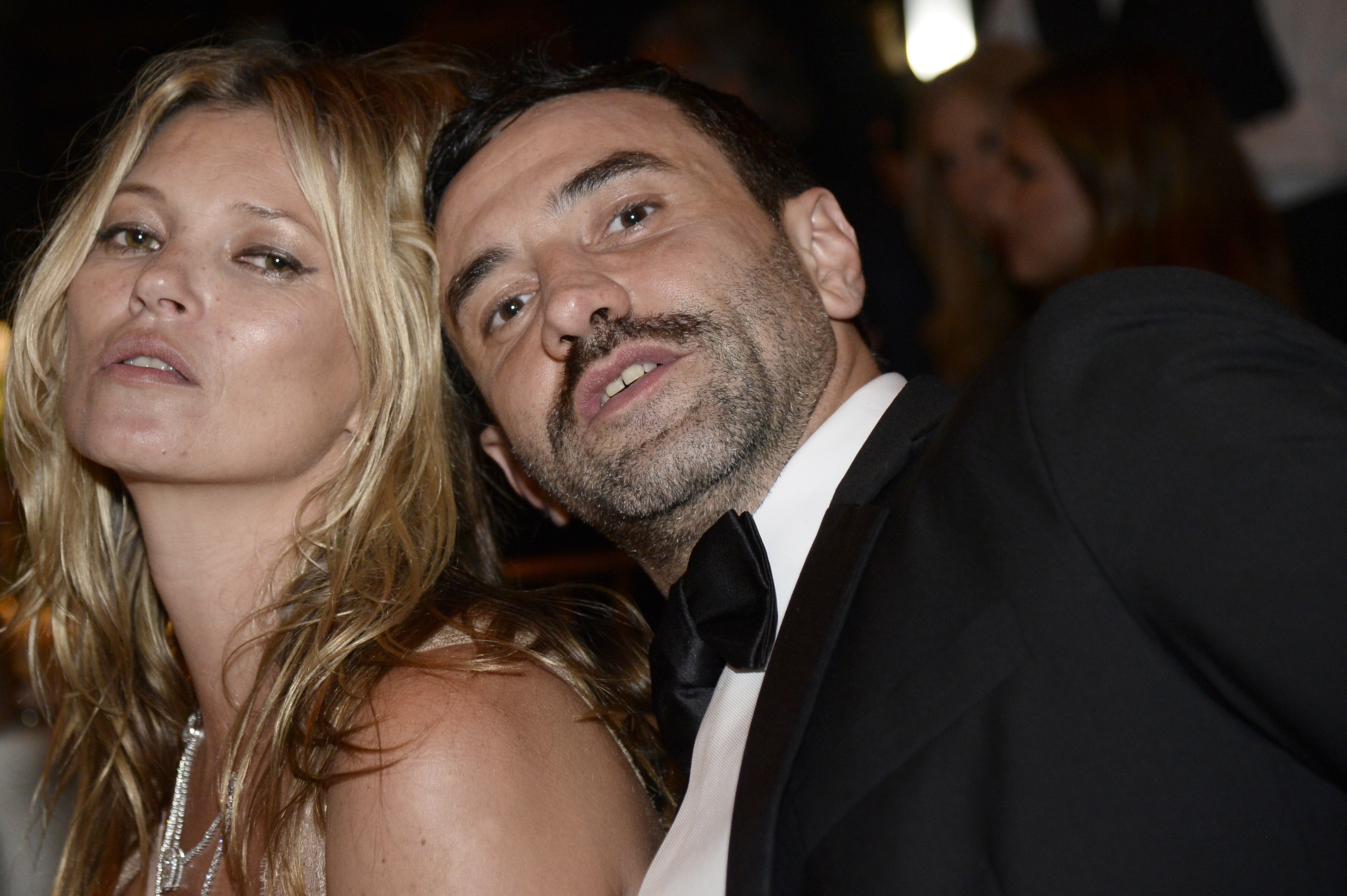 Tisci, seen here with supermodel Kate Moss, is one of the fashion world's biggest names