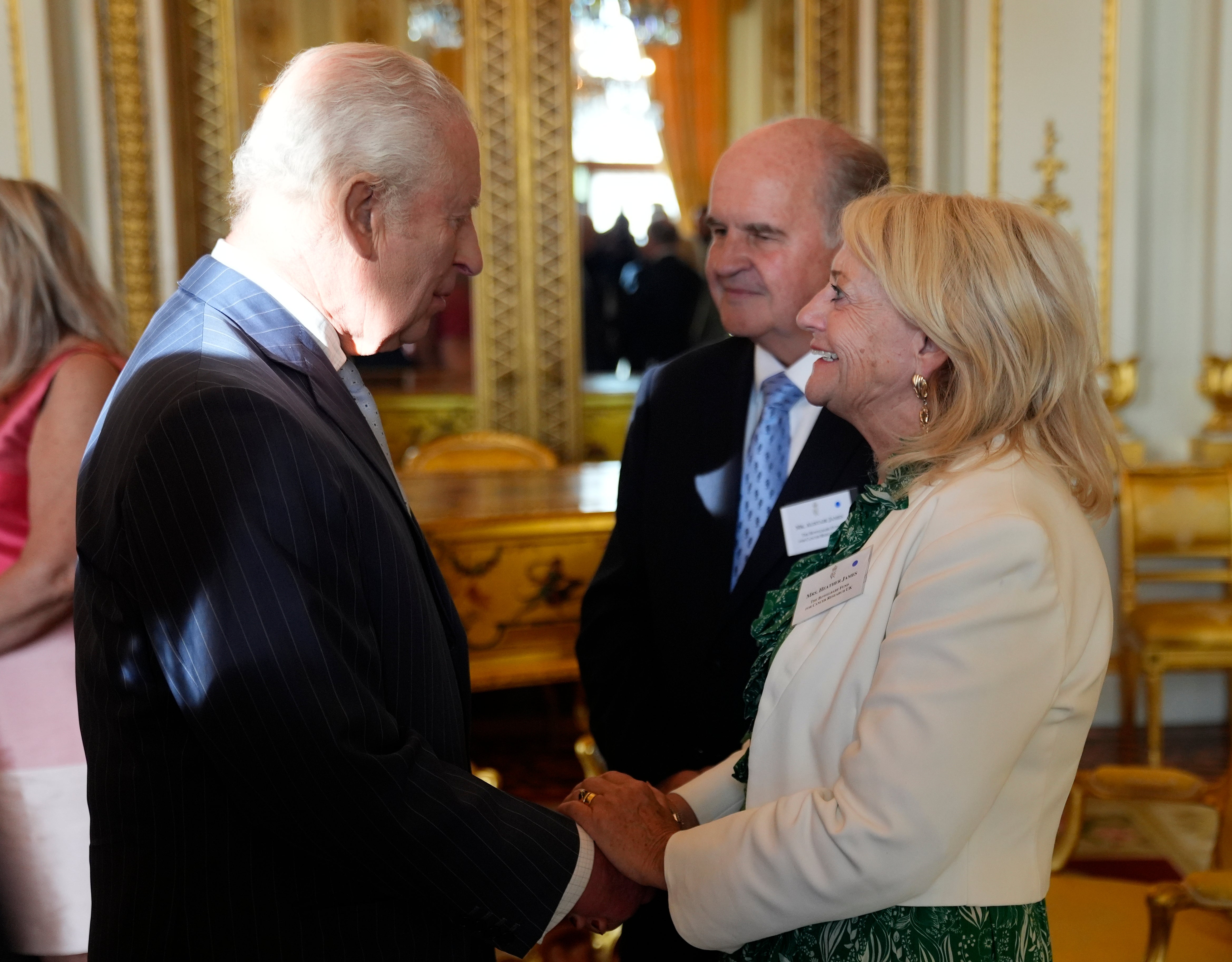 The King speaks with Alistair and Heather James, the parents of the late broadcaster Deborah James