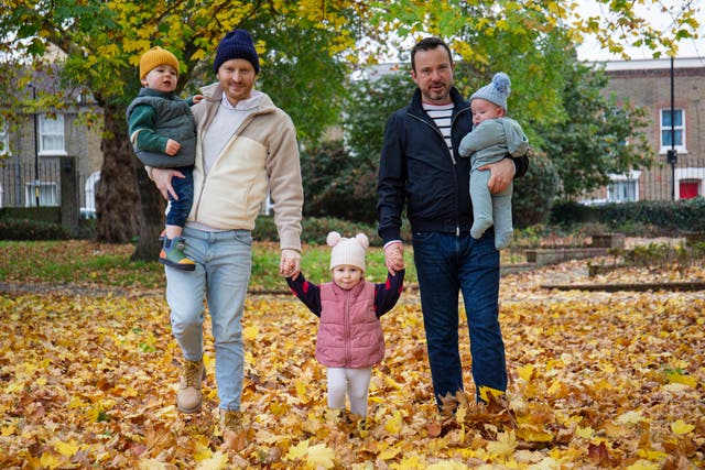 <p>Shaun Thomas and Paul Brennan with their children Margot, Tomas and Rian</p>
