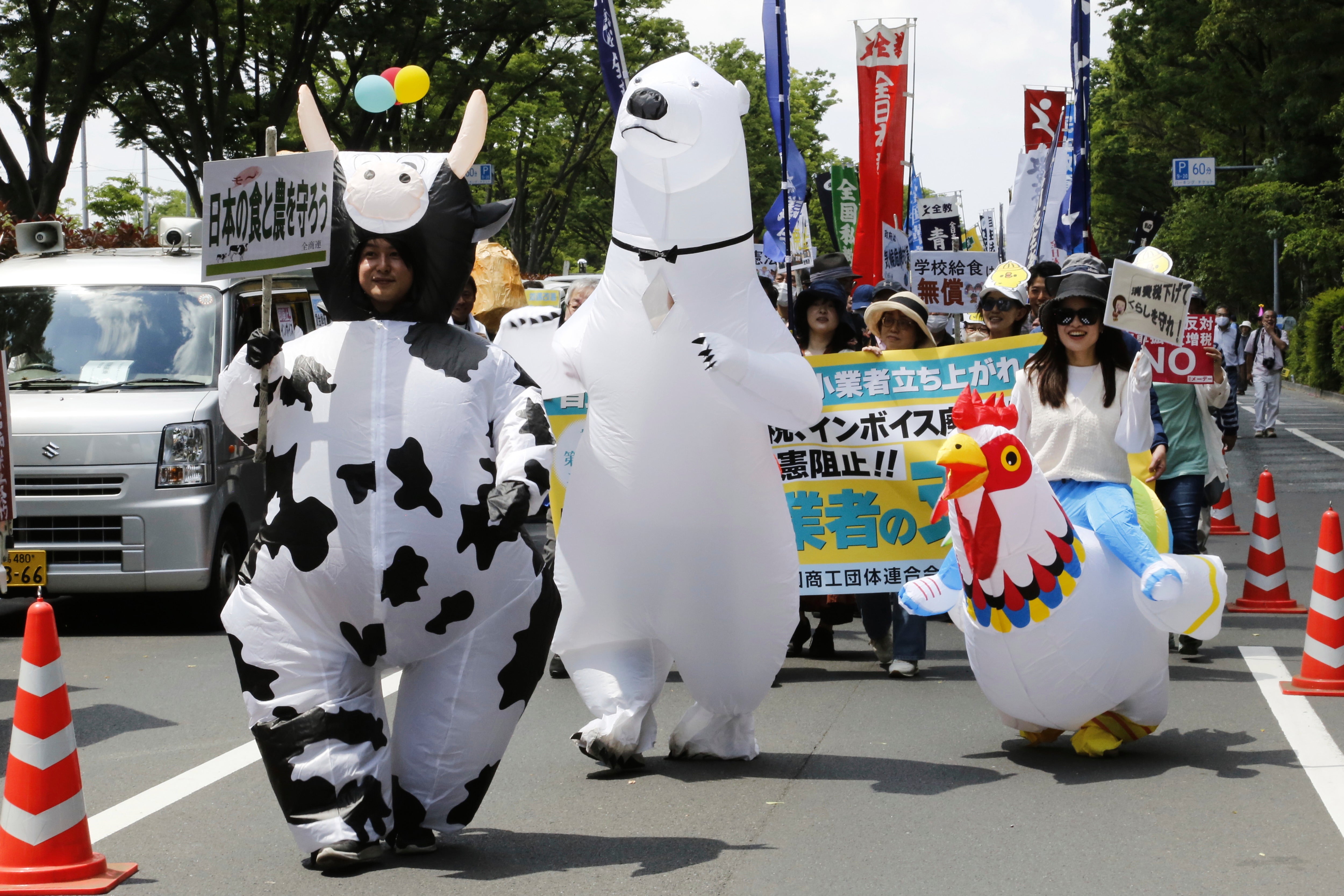 Peoeple march through the streets to mark May Day in Tokyo